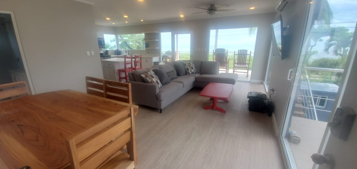 Open plan living and dining room with ocean views