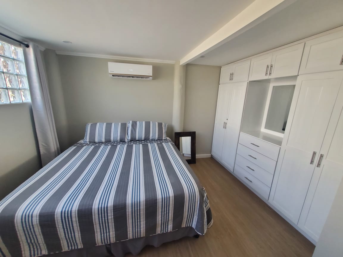 Master bedroom with built-in wardrobe wall