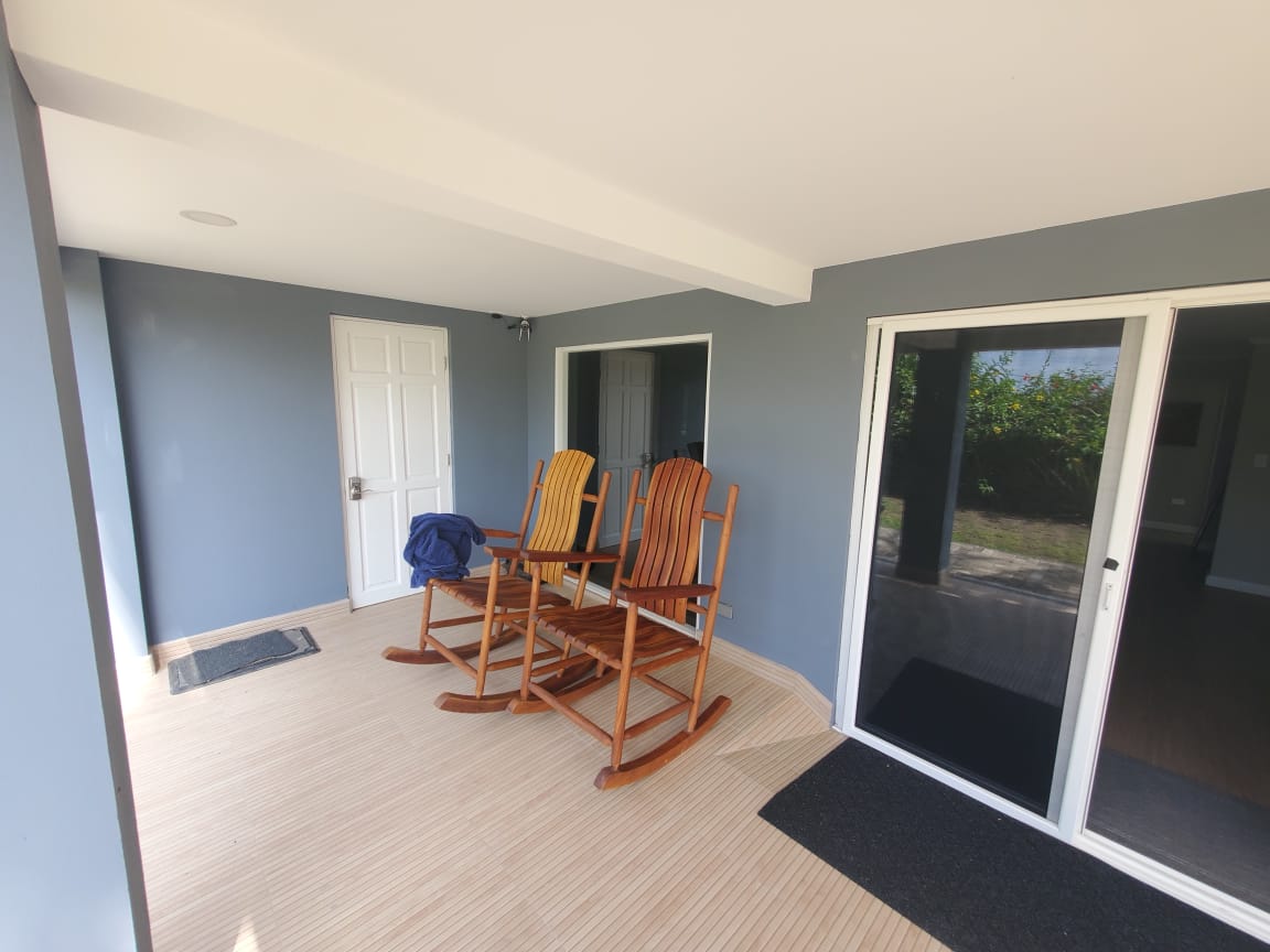 Covered porch with rocking chairs